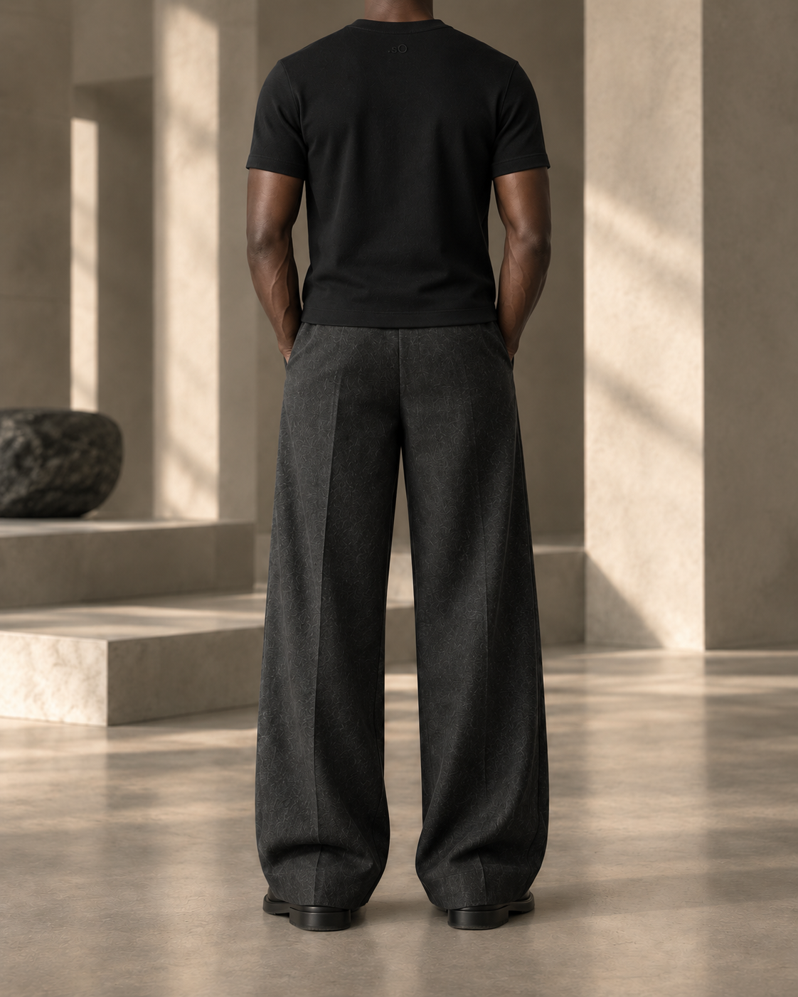Cropped upper-back view of The Essential Black T-shirt with tonal .sO signature